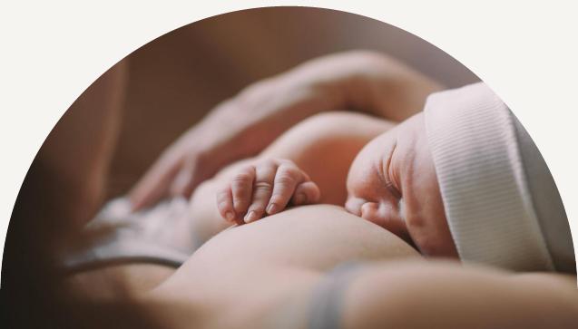 Mother Holding and Breastfeeding her newborn child, mother nursing